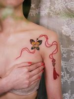 Butterfly norigae with red strings #tattoo #norigaetattoo #fantattoo #peonytattoo #colortattoo #flowertattoo #tattooistsion