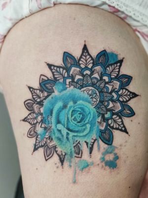 Realism turquoise rose and mandala tattoo on the thigh. 