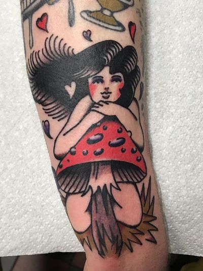 Fairy tattoo by Justin Rockett #JustinRockett #TattoodoApp #TattoodoApptattooartist #tattooartist #tattooart #tattooidea #inspiringtattoo #besttattoo #color #traditional #mushroom #fairy #arm #hearts
