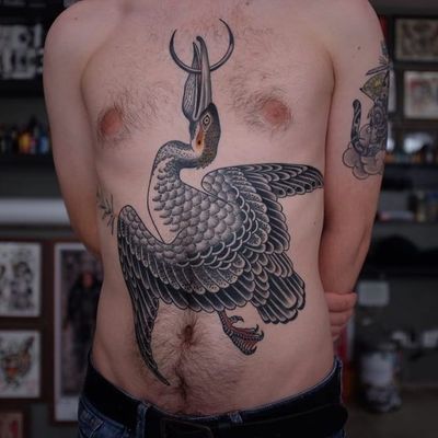 Bird tattoo by Andrei Vintikov #AndreiVintikov #WishParis #TattoodoApp #TattoodoApptattooartist #tattooartist #tattooart #tattooidea #inspiringtattoo #besttattoo #bird #pelican #feathers #wings #moon #chest #stomach