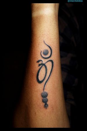 OM tattoo at OUCHFor bookings call 7382521886, 9848597806.