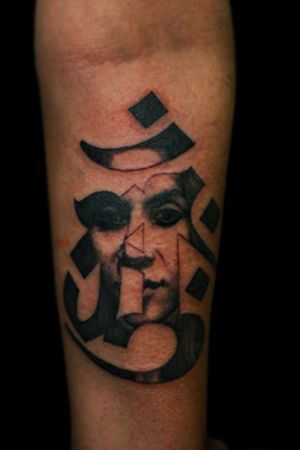Om Tattoo With Face