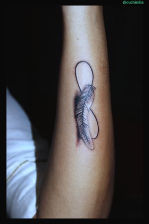 Infinity feather tattoo at OUCH.                                      For bookings call at 7382521886, 9848597806