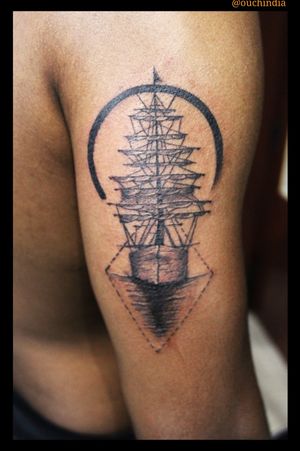 Sail boat tattoo at OUCHFor bookings call 7382521886, 9848597806.