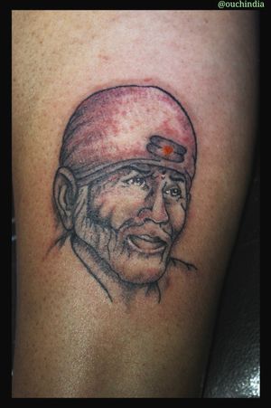 Saibaba tattoo at OUCH.                                                                   For bookings call at 7382521886, 9848597806