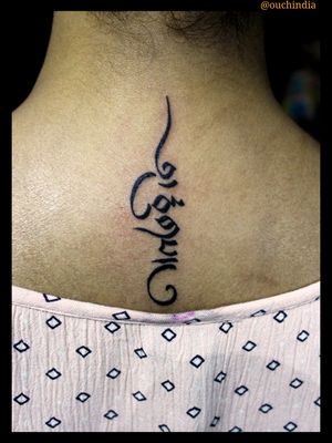 Tibetan script tattoo at OUCH.                                      For bookings call at 7382521886, 9848597806