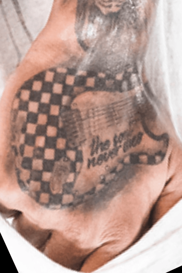 checkered flag shoulder tattoo