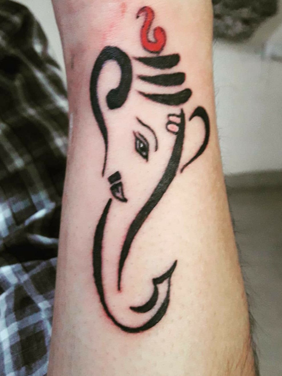 Amazing small simple Ganesha tattoo on wrist  Ganesha tattoo Hindu tattoos  Hand tattoos