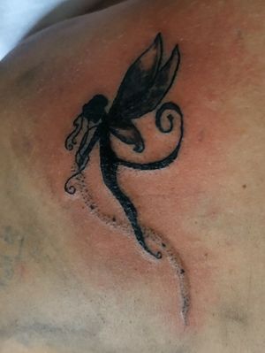 Fresh fairy tattoo on back 