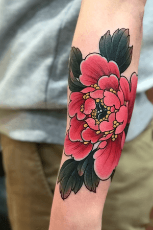 Peony flower on wrist.