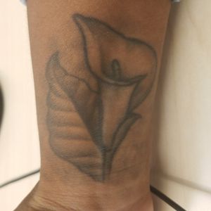 Need a tattoo fixed or covered up. I stopped the artist from completing the work years ago as it was not up to par for a flower (Calla Lily). Its a dedication to my Grandmother and I'd like to have it done beautifully. 