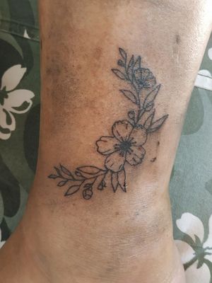 Little floral tattoo on ankle