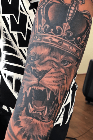 Roar lion king black and grey realistic tattoo on dark skin