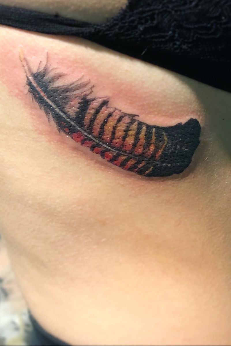Tattoo uploaded by Thatcher • Red tailed black cockatoo feather 