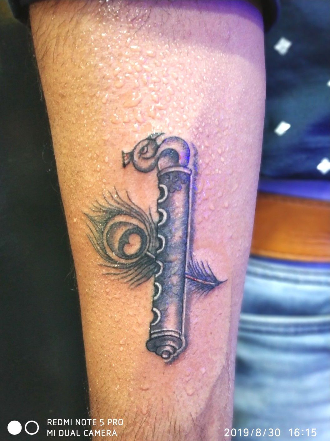 Tattoo uploaded by Samurai Tattoo mehsana  Flute with feather tattoo  Krishna tattoo Lord Krishna tattoo Dwarkadhish tattoo   Tattoodo