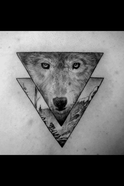 Instagram: @rusty_hst Another black and grey geometric wolf in the books. #blackandgrey #realism #wolftattoo #blackandgreyrealism #geometric #nature