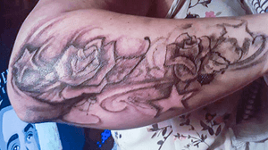 Floral with Stars pattern on lower forearm. 