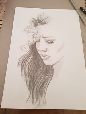 Sad girl drawing 