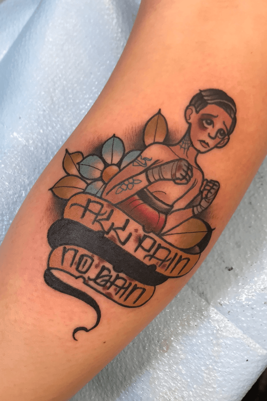 No pain no gain lettering tattoo handwritten on the