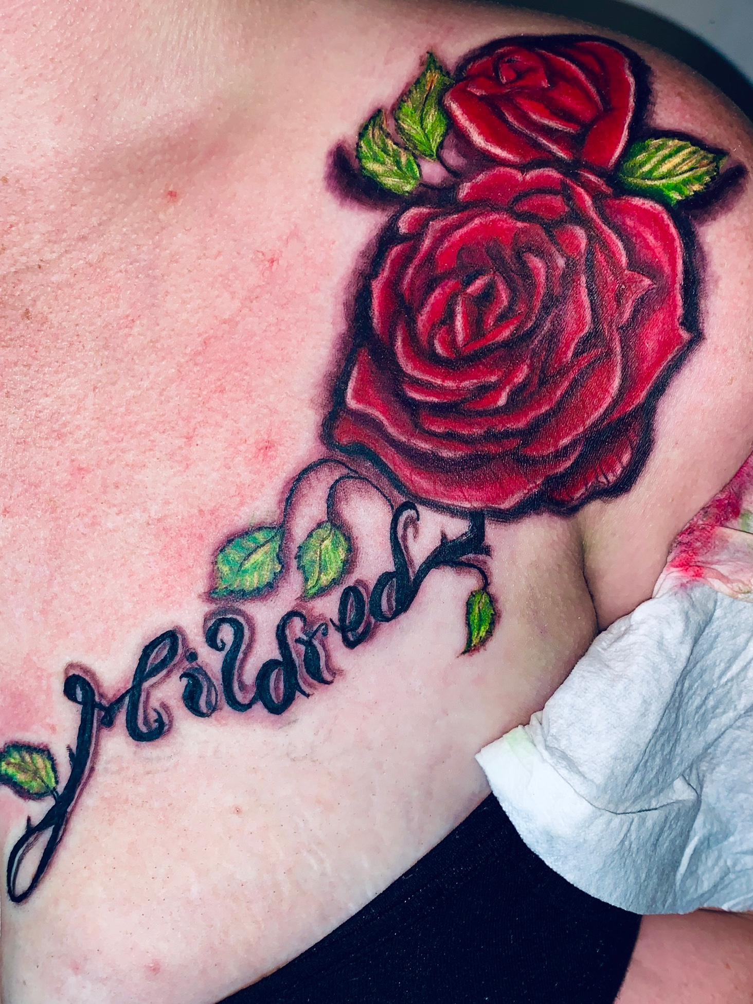 rose tattoos on chest with names