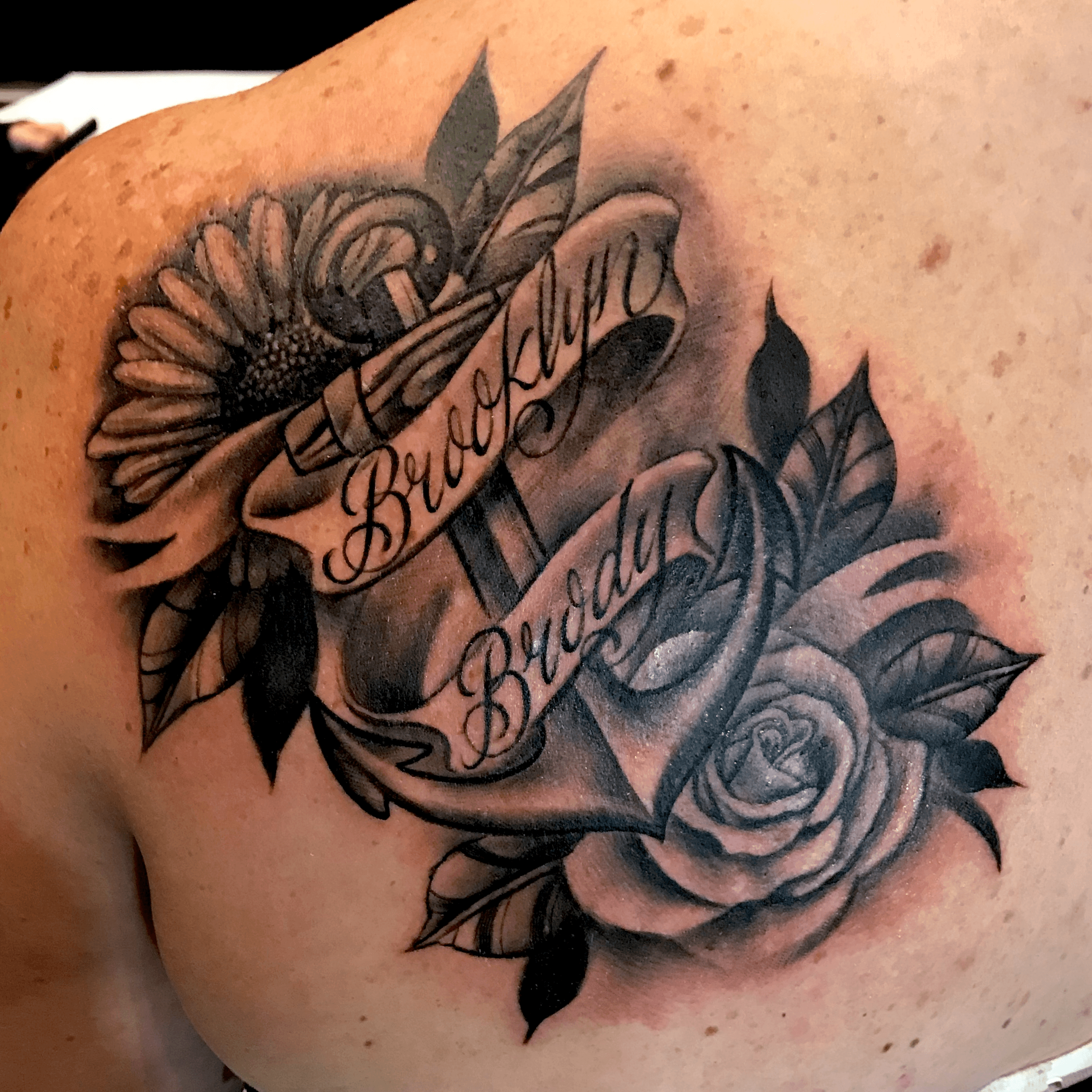 rose tattoos on chest with names
