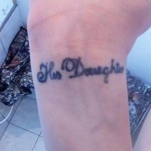 "His daughter" Me and my dad got match alike tattoos mine says "His daughter" and my dads says "her dad"