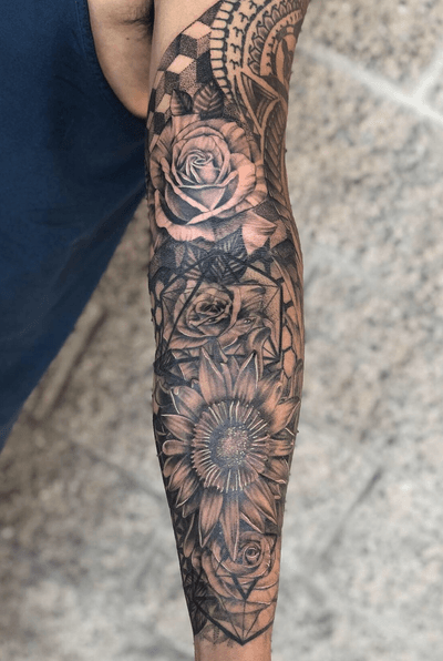Finally finished this up flowers and geometric mix. Half is healed. We did a wing on the other side by some tribal from awhile back. Happy how this sleeve came together. Hit me up for your next piece! Still have openings for late September. And October is open! Good job @coy_can sitting like a rock! #sleevetattoo #roses #kingprotea #flowertattoo #geometrictattoo #dotworktattoo #bng #blackandgrey #dynamic #ttechneedles #vertix #fusionink #cypress #oclongbeach #skanvas