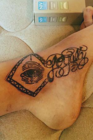 Tattoo says loyalty I did it on my foot with an eye ball
