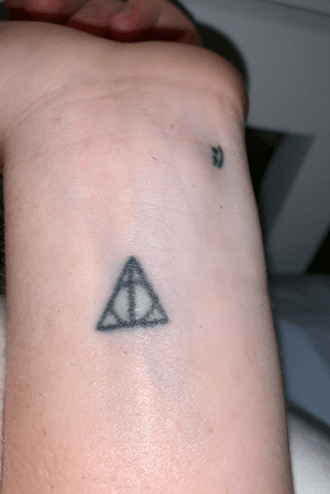 Deathly hallows and winkey face on my wrist