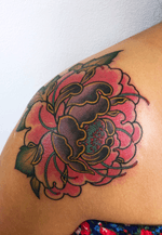Sweet peony on tanned shoulder 
