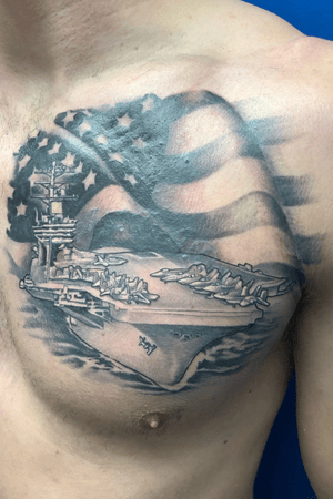Aircraft carrier covering a old name done using #empireink #aircraftcarrier #navy #america #flag #blackandgray #patriotic #chesttattoo