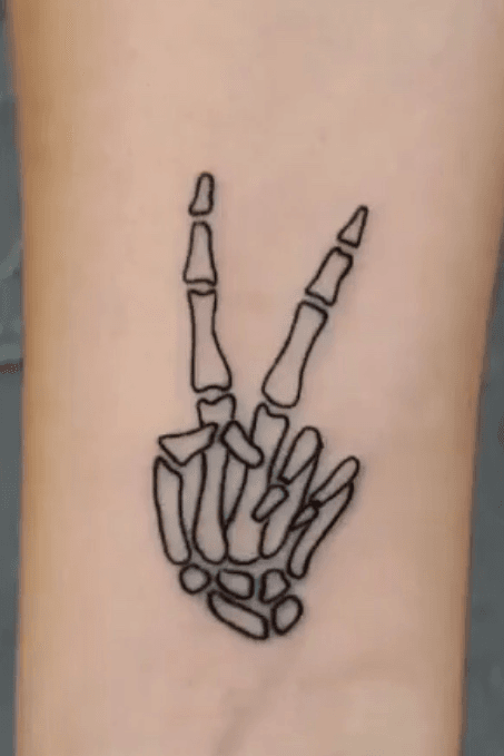 Skeleton Hand Peace Sign Tattoo by bethanymorgantattoos  Tattoogridnet