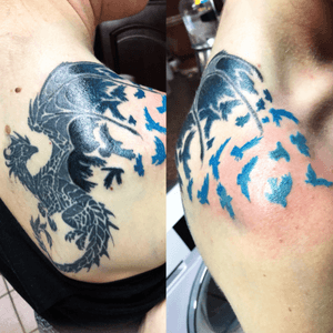 Upper back shouler tattoo of dragon breaking into birds 
