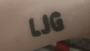 Initials “prison tattoo” done on wrist 