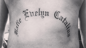 Old English lettering. His daughters names #oldenglish #letteringtattoo #lettering #oldenglishtattoo #stomachtattoo #nametattoo #daughtersnames #familytattoo #family #love #names #text 