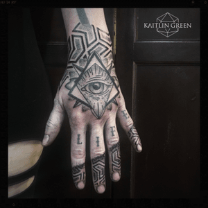 Geometric all seeing eye hand tattoo for women, black and grey, pattern, geometry, finger tattoos, dotwork, linework done by tattoo artist Kaitlin Green in Denver Colorado. 