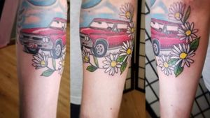 This is a tattoo dedicated to my grandparents, my grandpas last muscle car was a 1963 cherry red chevelle, his name was Bob and my grandmas favorite flower was a daisy, her name was Pattie They were together to til the end and were a huge part of my life, I owe a lot to them