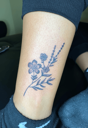 Free hand, flower leg tattoo with light black gray shading 