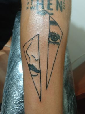 Triangle women face tattoo 