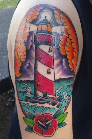 Done by Uli at Bold Lines Karlsruhe. #traditional #sleeve #color #lighthouse #traditionaltattoo #colorful #colortattoo #sunset #sunrise #sky #ocean 