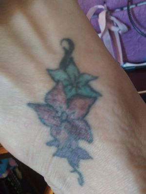 This was done on my foot a few months before my sister committed suicide as she begged my mom and i to go and get the same one each picking a flower color. On top of foot