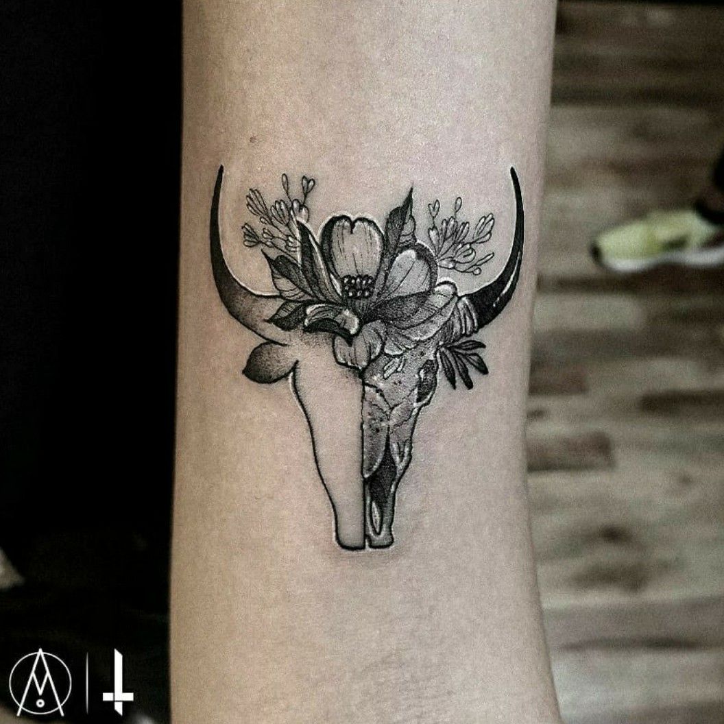 Taurus inspired bull skull tattoo on the inner forearm