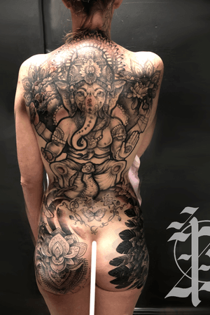 Full back and bum cheeks of black and grey mandala and pattern work on this Ganesh. Several cover ups worked in and an Native American thigh and bum tattoo. 