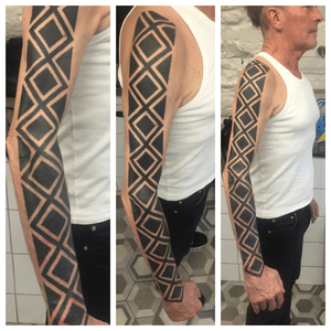 Three photos of the same tattoo. This is his first tattoo by the way. #snakeskintattoo #protection #blackwork #blackworktattoo #burlingtonsocks #tattoo