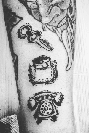 Sketch style “keys/phone/wallet” daily reminder tattoo.