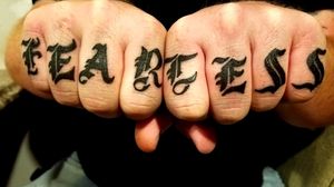 "Fearless" knuckle tattoo