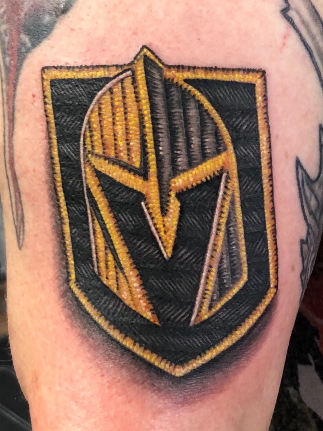 Golden Knights fans get team logo tattooed, in hair and on nails