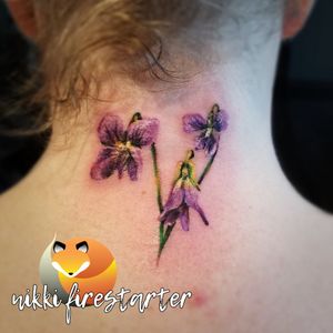 Cute lil violets behind the neck 🌸🌿 nikkifirestarter.com #flowertattoo #flowers #floraltattoo #floral #violets #smalltattoo #cutetattoo #necktattoo #fullcolor #colortattoo #plant #illustrative #realistic #vivid #brightcolor #colorflower #purple #prettytattoo #tattoo #bodyart #bodymod #ink #art #nonbinaryartist #nonbinarytattooist #mnartist #mntattoo #visualart #tattooart #tattoodesign 