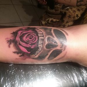 Skull with rose in mouth