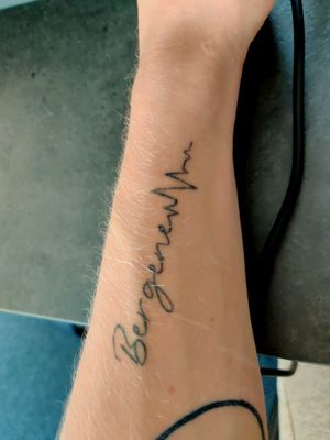 My last name as my first tattoo on my forearm.
